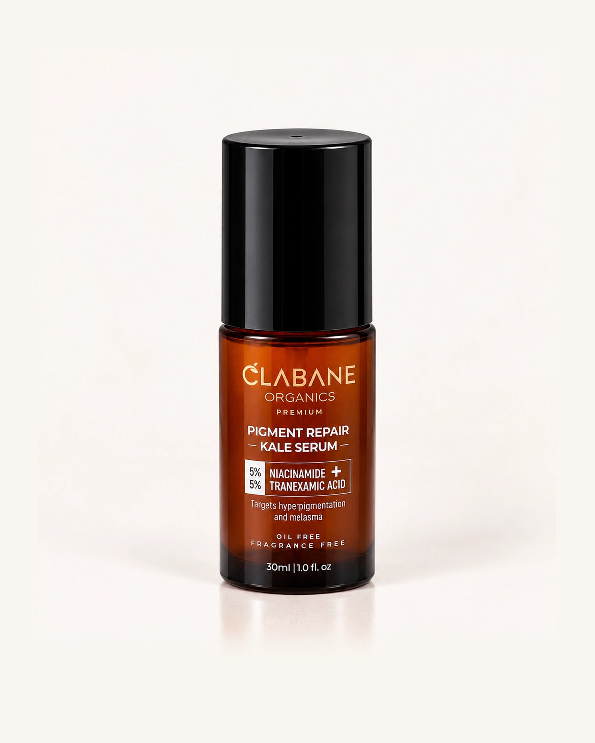 A 30ml amber glass bottle of Clabane Organics Pigment Repair Kale Serum with a black cap, set against a clean white background with a soft reflection.